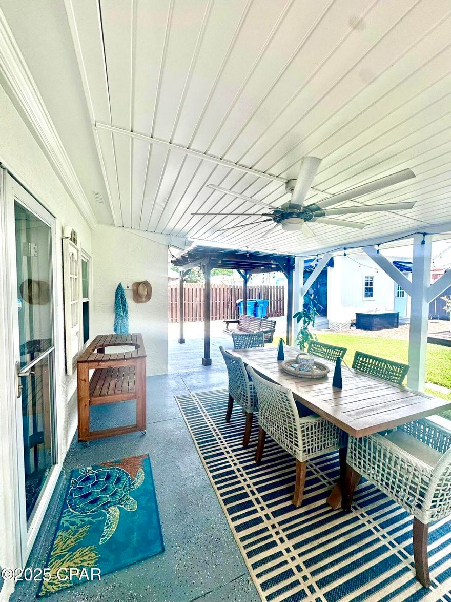 Under Contract, with contingency loan approval.,  Seller taking backups. Adorable Beach Cottage just steps to the most gorgeous crystal white sandy beach on the Gulf you'll ever see on the west or east coast of Florida......move in with nothing to update, or consider it rental ready for the pickiest buyer and/or renter..
This darling place will rent quickly and stay rented if you are an investor, or keep it for yourself to enjoy with family.  A perfect guest area is a renovated 1 bedroom, 1/2 bath cabana in back yard  (not included in tax records) with loft for the elementary children or young adolescences to sleep.  A kitchenette is included with refrigerator, sink, counter space, etc.  Also included is an outside shower on a newly built deck with a door (for privacy)  on the right side of this cabana perfect for sandy feet and oily bodies.  This is a precious, well thought out addition to the main house which has a primary bedroom with sitting area, 1 bath and living room, guest bedroom and kitchen. (Extra space in the Cabana explains square footage .....guestimate by agent..... )with extra bedroom, being used for in home office at present, and 1/2 bath) A new deck was added as a porch to the back cabana with awning over door.  Main Front cottage also has an outside shower to the left backside.  The guest room in this main house has a door leading to back yard and outdoor shower, as well as the primary bedroom with sitting area and back door onto the back covered porch.   Primary bathroom has double sinks and a beautiful brand new tiled shower just recently replacing a dated bathtub.  You'll be pleased to find an updated modern kitchen with modern stainless appliances.  Both buildings were freshly painted inside and out March, 2025.  New trellises were built recently on each side of the back porch with aluminum roofing to enjoy shade for cookouts.  New Roman shades were added throughout.  Epoxy coating was added to concrete front porch and back patio.  Ramp to golf cart garage was replaced with composite wood. New landscaping was added to front and back yards.
Don't miss this opportunity to own your own piece of Beach Haven whether you decide to keep it as your own, or rent it to many lucky guests.  This property has not been rented previously.