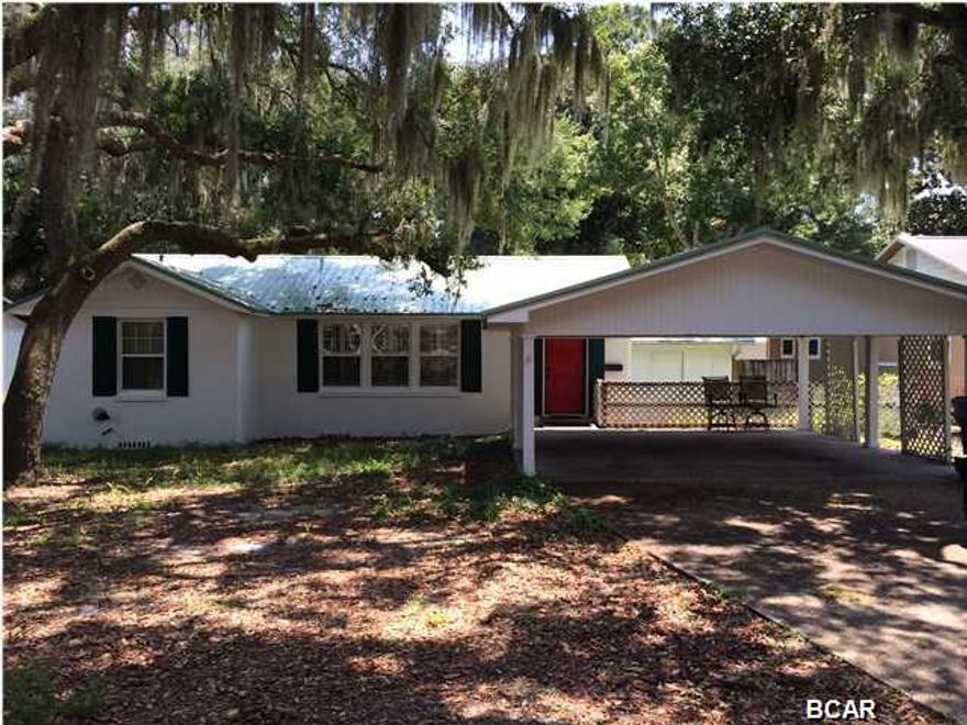 Great Cove Home - this is a 3 bedroom (possibly 4 - with small office and closet)2 bath home featuring lots of hard wood floors and a very large master bedroom lined with cedar. This home also features a separate storage room, and large sun deck with fenced back yard and covered car port.