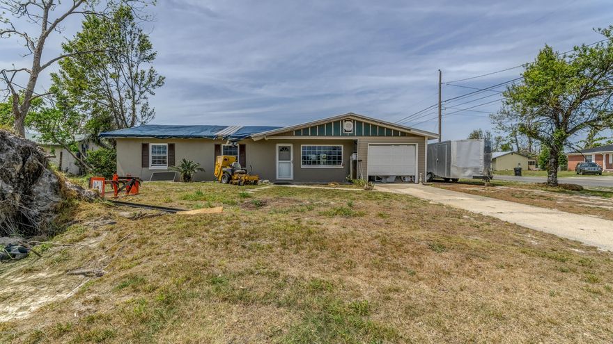 Perfect investment opportunity! This 3 bedroom 2 bathroom home boast over 1,700 sqft and is conveniently located close to great schools, shopping and Tyndall. Highlights include a metal roof and a garage. This home is nestled on over a quarter acre corner lot. This home has tons of potential whether you're looking for a quick flip or a place to call your own you don't want to miss your opportunity.