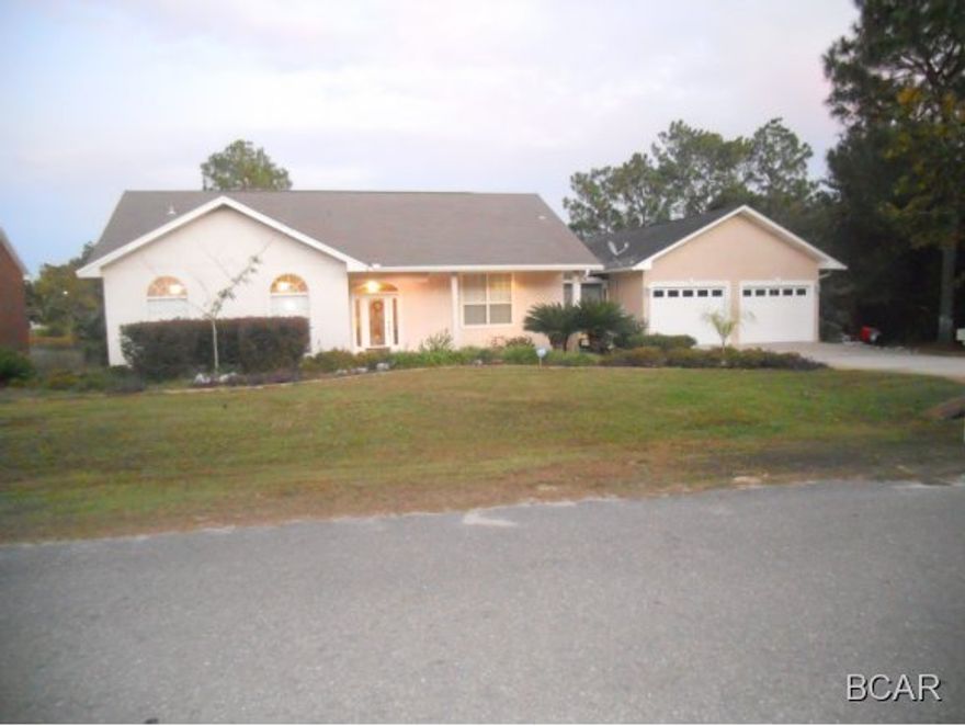 Wonderful Lake home with dock! There are Lake views off the Master Bedroom as well as a nice large outside patio off of the Master, dining, and living area. This extra large back patio is perfect for entertaining and relaxing. The kitchen features a built in wine cooler and solid surface countertops. It has nice built-in shelves, a huge laundry area, built in office area, oversized garage and much, much more. This home is a MUST see on your showing list!