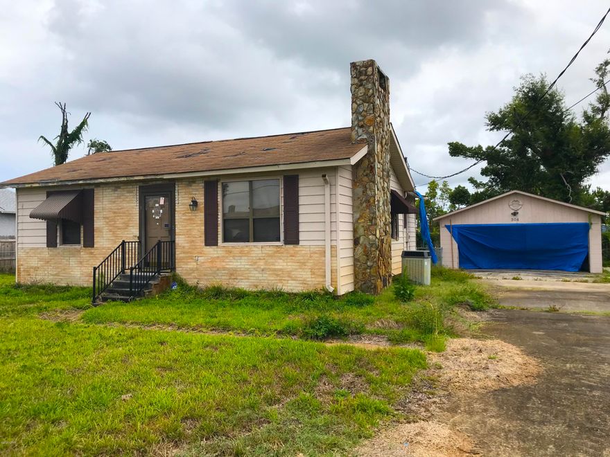 AMAZING fix & flip or investment opportunity with this 3 Bedroom / 1 Bath home in Panama City! The home is It is 1,255 sqft. (heated) and 2,106 sqft. (total). It has a great curb appeal on a big lot, a beautiful brick & stone fireplace, open floorpan kitchen, and a detached 2-car garage and shed! The home did have damage from Hurricane Michael and will require some repairs - roof, interior, etc. - But at this price IT IS A STEAL! This property WON'T LAST LONG - So act quickly! --- CASH BUYERS ONLY ---
