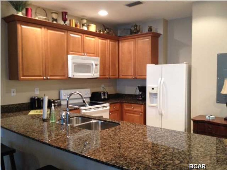 Fabulous first floor unit at a great price being offers partially furnished in Reflections. This unit has tile throughout living areas, carpet only in the bedrooms. Location on the ground floor means no elevators! This one wont last long at this price...call your Realtor today to see it before it is SOLD!