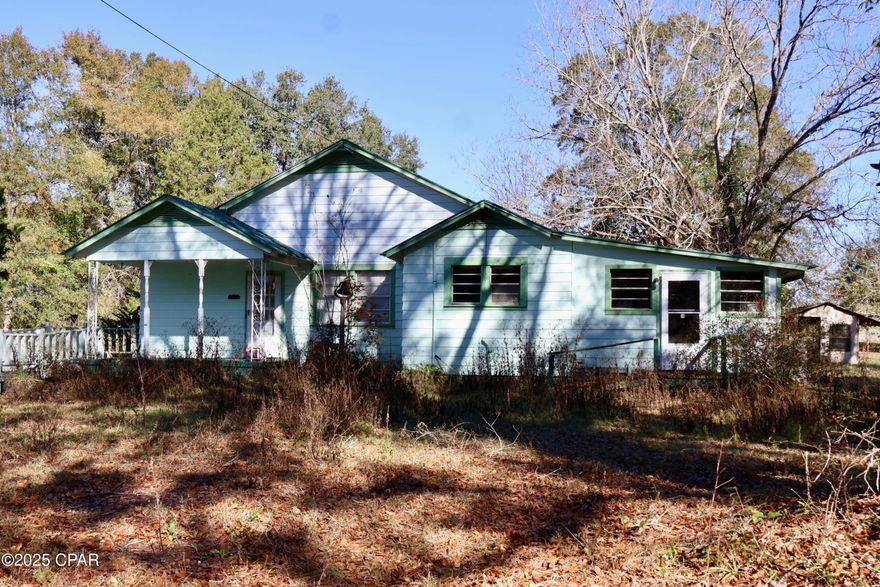 This 2 bedroom-1 bath home, offers 2,365 sq. ft. of living space. Built in 1945, this property sits on a 2.8 acre lot. Inside, you'll find a kitchen with wooden cabinets and laminated countertops, bedrooms with custom cabinetry and carpeted flooring, and a sunroom with blinds. The layout provides flexible living space and strong potential for updates or customization.

Outside, the property features a wheelchair-accessible ramp, a wide backyard with mature trees, wired fencing, and a private rural setting with a new well pump.