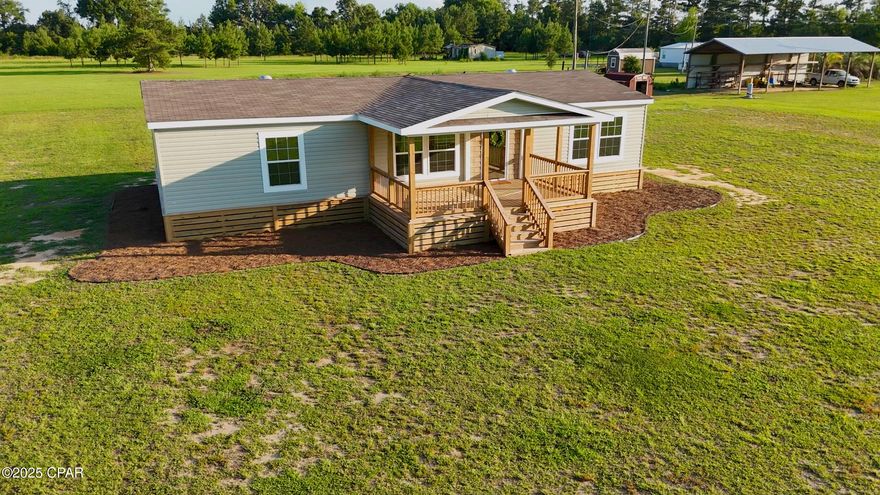 Have you been looking for a piece of land in the country to put a mobile home on and you've given up hope?  Well, guess what?  Someone else has already done all the work for you and the keys are ready to hand over!  This like-new 1568 sq foot, 3 bed 2 bath home is situated on a paved road on 1.4 acres in the Dellwood community.  It is already adorned with a large front porch for outdoor lounging and the yard is cleared, flat, high, and dry!  Step inside and your every desire is met by an open concept living space, a split floor plan, a sprawling master suite, and modern finishes.  This place is rare and won't last long!  Call today, see it to believe, then lock it in!