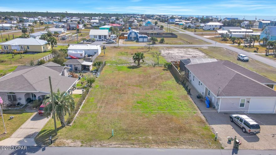 Beautiful, ready to build on lot, located just 1,000 ft from the beautiful Gulf of Mexico. Lot is just off of 98, and a short ride to Tyndall. This lot is located within walking distance from to dining and entertainment. Lot has tap fees paid for water and sewer. If buyer closes on or before 2-25-23, seller is offering $5,000 towards closing costs! In addition, with a full price offer, seller will include a full set of certified plans for a 2,400 sq ft., 3 Bedroom 2 Bath home.