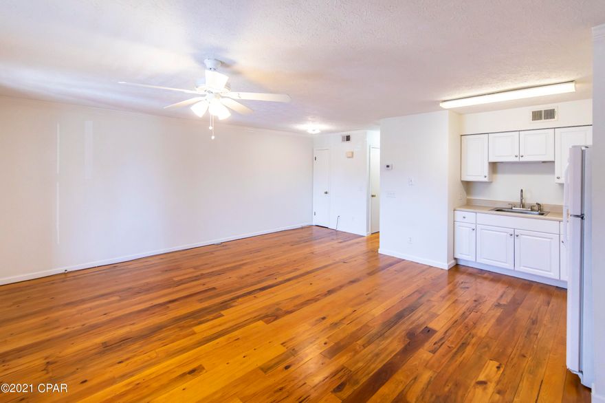 Great one bedroom unit in Greenwood Estates. Enjoy the community dock and pool while being conveniently situated near Thomas Dr. and Front Beach Rd. This open floor plan features hardwood flooring in kitchen & living area with carpet in the master bedroom.