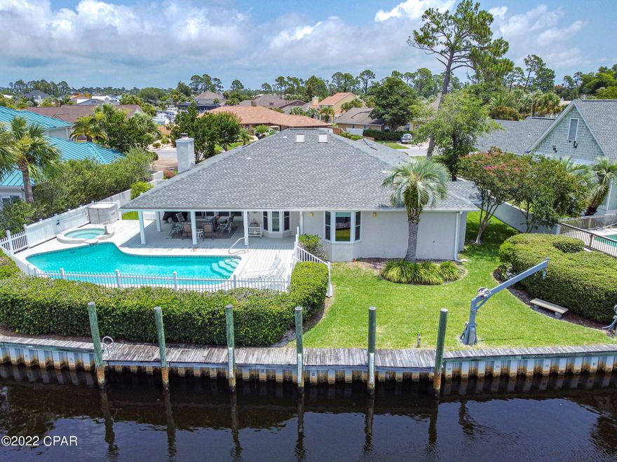 BEAUTIFUL BAY POINT CANAL HOME w/ POOL.  110 ft on the canal w/ great views in all directions.  Open & covered areas around pool and hot tub.  Inside home is open, bright and airy w/ lots of natural light.   Wonderful floorplan with LR, formal dining, separate breakfast area w/ bay window to canal & pool.  Bonus room perfect for home office/den/library/exercise room - could even turn it into an extra bedrm.  Kitchen w/ skylights, island, pantry & desk.  Gorgeous quartz countertops.  Master faces canal & pool.  Very spacious.  Master bath has garden tub, separate shower, two vanities and two large closets.  Down a separate hall are two guest rooms, one with it's own bath

All this plus the amenities of Bay Point:  golf, tennis, marina.  All measurements estimated.  Re-measure if important