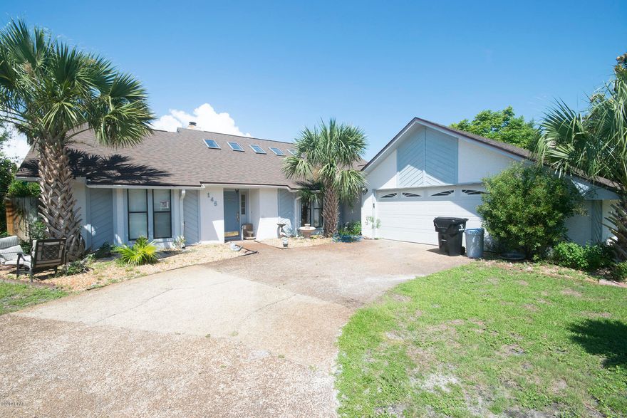 145 Grand Lagoon Shores, three bedrooms, two full bathrooms, half bath for guests and a POOL! A spacious driveway and 2 car garage, walk in to a sizable family room open to the dining, kitchen and sliding doors to the fenced backyard and in-ground pool. The floor-plan is split with two beds and a bath on the left and a large master bedroom with a full bathroom on the opposite side of the house. Grand Lagoon Shores is located off North Lagoon on PCB, close proximity to Navy Base, Grocery, restaurants and the Gulf of Mexico! Bonus - brand new roof! Come visit today!