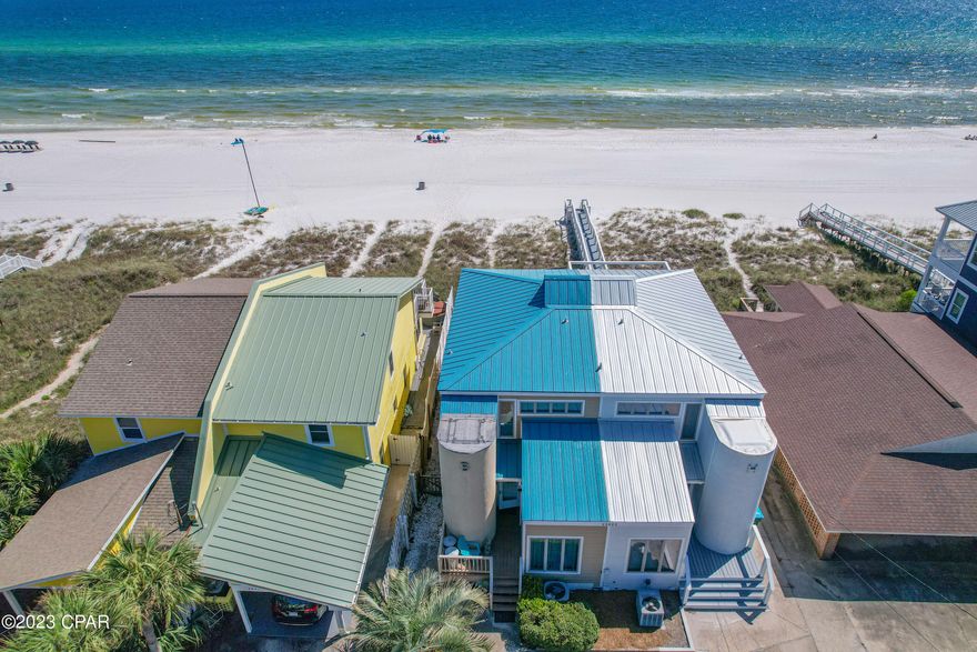CURRENTLY UNDER CONTRACT, SELLER WILL CONSIDER BACKUP OFFERS. Rare opportunity to own a WATERFRONT TOWNHOME on the Highly Desirable and Quiet West End of PC Beach. With NO HOA or Parking Decks! Located just 5 minutes to Carillon Beach and Scenic Hwy 30A and 15 minutes to Pier Park.  This home feature a 20' gulf view from the expansive living room..  5/8' Solid Pine Hardwood Floors with pressure treated subfloor.  9.5' ceilings downstairs. Waterfront Bedroom and Balcony on 2nd Floor. Perfect home to make life long family memories like the owners have done for the past 43 years. Or as a vacation rental property.  Water Heater 2022, Refrigerator Range and Dishwasher 2022. Kitchen Metal Bar and Ceiling are Galvanized. 540 sqft of Trex Composite Decks. 154 sqft  Trex Composite Balcony.  Parking available for 6 autos. BUYER TO VERIFY ALL IMPORTANT INFORMATION