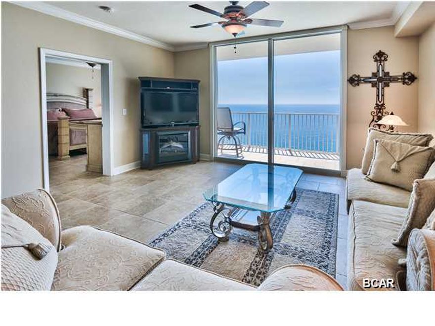 This is the pristine, high-end unit you have been looking for in one of the most well equipped resorts on Panama City Beach! This unit is a HUGE 2 bedroom, 2 bathroom condo with almost 1600 sq. ft of living space. The two large bedrooms each attach to a bathroom with the master bathroom having an incredible standing shower, separate tub, and a huge walk-in closet. The second bedroom can easily house 2 queen beds or multiple bunks the maximization of rental revenue. The view from the unit is incredible and the master bedroom has a gorgeous bay window and access to the balcony. This property has a washer and dryer in the unit and a well stocked kitchen. This is one of the few properties that have NEVER BEEN RENTED in Tidewater and features multiple upgrades including thicker granite,