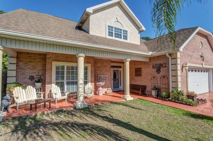 Beautifully maintained 2 story home with open floor plan in family friendly Pelican Bay neighborhood minutes from beach, local schools, shopping and restaurants. This 4bd/3 bath brick and stucco home has a home office with built in maple workstations/storage, loft that serves as a second family room and 2 master suites on the ground floor. All 4 bedrooms are large enough for king sized beds. All 3 bathrooms have tub and shower. Outdoor shower helps to keep sand outside. New carpet throughout upstairs. Granite countertops in kitchen. New sod in front yard May 2018. Plenty of space to relax outside on front patio or screened porch in back. Neighborhood pool, hot tub, club house and access to St. Andrew's Bay provide family friendly entertainment options. All reasonable offers considered!