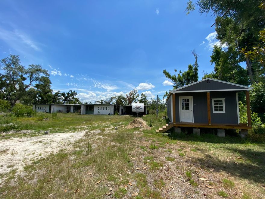 *UNDER CONTRACT ACCEPTING BACKUP OFFERS* Investor special! Here you have the bones of a 3,000+ sqft home on a large 1.86 lot in Southport! Quiet country living located on Gainer Bayou which would accommodate a canoe or small fishing boat. Never lived in tiny home displayed in pictures conveys with property. 



The main house features 2 XL living rooms (both with fireplaces), 3 large bedrooms, 3 full bathrooms, 1 bonus room, a spacious dining area, an open kitchen, an interior laundry room, and numerous storage closets. The 3rd bedroom is split from the other two and could be used as a master also. 



The portable 16x36 cabin style ''tiny home'' also conveys with the property. It is newly insulated and wired. With a little final finishing could be a rental or new owner could live in it as they fix up main house. 

Other features: Both septic tanks replaced in 2017. Both water heaters replaced 2017. Well pump and water treatement system replaced in 2018.

Property is RV ready with utility pole if buyer wants to park one.

A 10x20 slab is located where a new shed could be built and a large under ground pool needs some work but is salvageable for the new owner. Needs a decent amount of repair but so much potential for the right buyer! 2019 RV does not convey but seller open to "side deal" if buyer desires. No personal items convey in tiny home, carport, or back patio (seller taking bar).