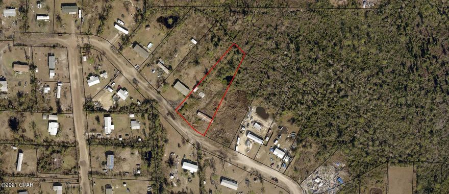 Large 1.074 acre, 117F x 400D, lot in the Bayou George / Youngstown Area. The property is zoned for a mobile home or residential single-family with a small pond in the back of the property. Has existing well, septic, and electric service access. The property is located only a few minutes from 231, grocery stores, emergency room, and boat launches. If country living is what you are looking for, this property is perfect; build your dream home here and get away from it all!