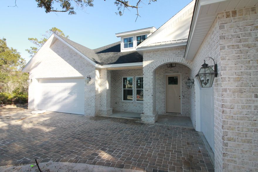 Stunning 5 bedroom 4 bath home with a media room and 3 car garage in one of the most prestigious neighborhoods in Panama City Beach. This home offers Custom wood cabinets, granite Counter tops, up graded light fixtures, tile floors, and has an open floor plan. It opens up to a Huge Covered Lani in the back just perfect for entertaining. This home is in a gated community on Panama City Beach Close to Golf Courses, Shopping, Boating, all the activities you Love about Panama City Beach. Don't miss this new construction going up right now!