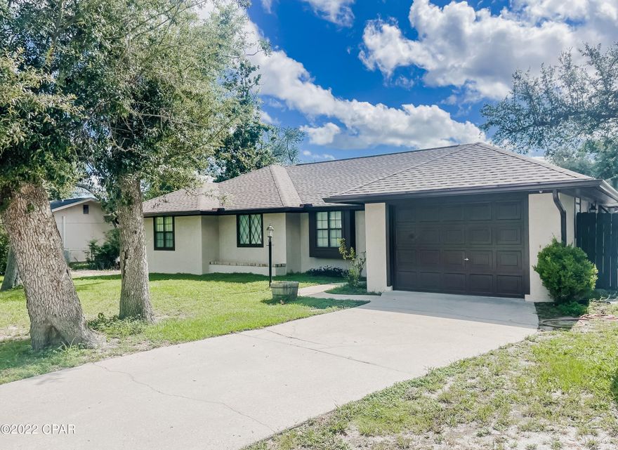 UNDER CONTRACT! SELLER IS ACCEPTING BACKUP OFFERS. This adorable 3 bed, 2 bath home sits on a large fenced in lot with a 24x36 enclosed building in the backyard. The home has new interior and exterior paint. The interior has been updated with newer LVP flooring, granite countertops in the kitchen, new light fixtures and a modern interior color scheme. The home features a large living area with a wood burning fireplace, a spacious formal dining room and a separate eat in area, a spacious master bedroom, with an updated master bathroom. The master bathroom features a custom tile shower and a separate deep soaking tub.