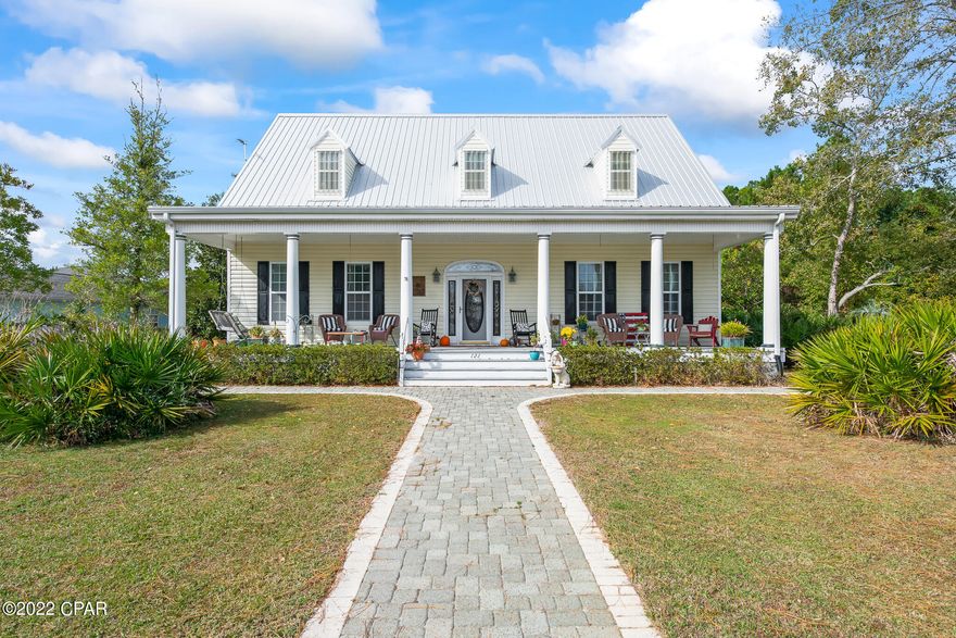 MOTIVATED SELLER!! 

This home harmonizes the Carolina's timeless charm with the alluring amenities of Florida's Emerald Coast. This southern cottage design, featured in Southern Living magazine, was created by William E. Poole Designs INC and was ''built to look as though it has always been there''. Extraordinary details have been conscientiously joined with exquisite craftsmanship in this custom 4 bedroom home including an upstairs studio and wet bar. Notable features include a sprawling front porch, custom arched entry way with adjoined built-in bookshelves, Australian Cypress hardwood flooring and handrails, 10 ft ceilings, fireplace, private dining room, 2 car garage, large backyard and outdoor shower. *New roof in 2019 and new dishwasher and farmhouse kitchen sink This is a special one you HAVE TO SEE!
Information contained within this listing such as square footage, is deemed to be accurate but is not guaranteed. Buyer to verify.