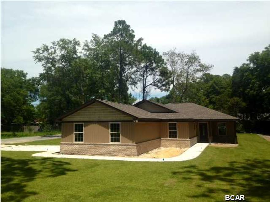 New construction in the heart of Lynn Haven. Beautiful exterior and interior features. This corner lot has a side entry garage and access to the backyard from the road. Perfect for extra parking and/or a boat. The exterior has upgraded vinyl along with shakers and brick on the front. The second you walk in you will notice tons of high end details. Upgraded front door, crown modeling, beautiful built in book cases, upgraded cabinets, solid surface counter tops, stainless steel appliances plus much more.