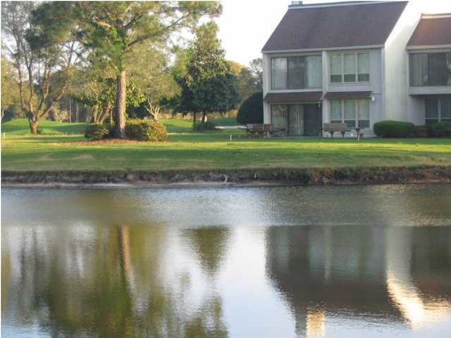 A ''Flat'' condo, with views of the pond and the new ''Nicklaus Golf Course''. Enjoy your mornings in the Florida Room or on the wooden deck, outside near the pond feeding the ducks. Afternoons can be enjoyed on your lg. private front tiled patio,  with privacy from everyone. Remember this is an end unit with lots of privacy and very quiet. This condo has been completely remodeled with ceramic tile everywhere except carpeted Bedrooms. All stainless steel kitchen appliances updated light fixtures - new A/C makes this a brand new condo!! Remember this is a ONE LEVEL condo with no stairs to climb and split bedrooms - you must see this spacious home. Fireplace has been covered but can access if desired. Listing Agent is related to owner. There is a Master Association fee $1325 per yr.