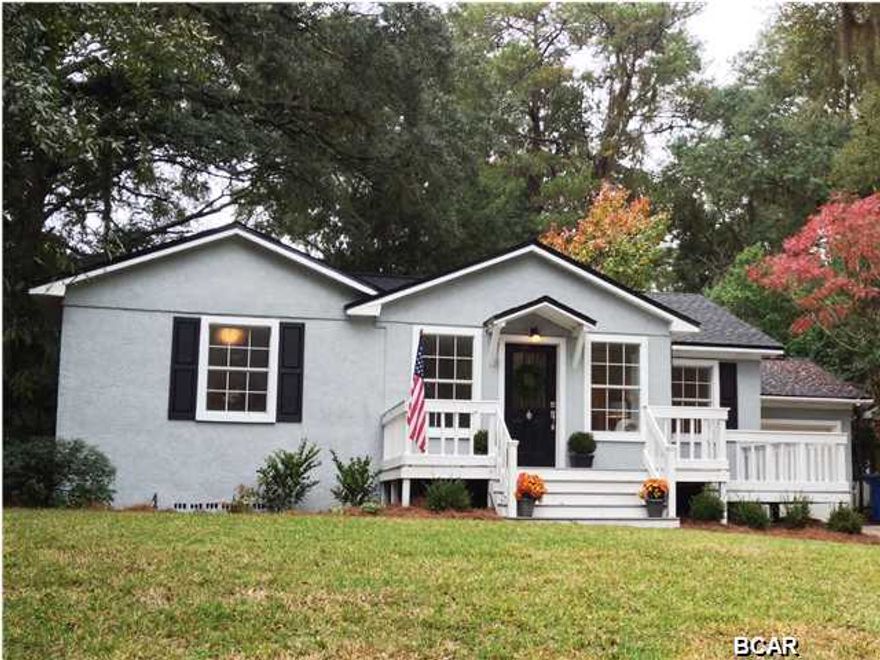 Here it is-- the PERFECT COVE HOME! This ADORABLE Bungalow-style cottage has been recently renovated and updated from top to bottom, with particular care paid to preserve its coziness and Southern charm. Ideally situated on a high corner lot, you'll enjoy sitting on the large front porch and watching squirrels play in pretty little Lannie Rowe Park (right across the street). Inside, a bright, open family room provides ample space to live comfortably, while still offering delightful vintage touches-- such as crown molding and GORGEOUS ORIGINAL HARDWOOD FLOORING. The kitchen has been completely redone and boasts new cabinetry and hardware, new stainless steel appliances, subway tile backsplash, and GRANITE COUNTERTOPS. The kitchen opens into the GARAGE and large fenced backyard