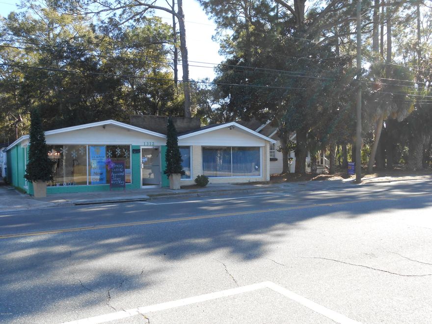 History-rich .40 acres commercial property in the center of historic St. Andrews. Views of marina leading out to St Andrews Bay. The property includes a 95 year old residence, that has been expanded, and a brick 838SF commercial building next door that was marine store. The store is 63 years old. Property being sold ''AS IS''. Great investment for commercial business to grow with the redevelopment of this lovely bayside community. Previous owner had an  office in the front and resided in the back of the house. The value is in the location and the land. Make an offer.