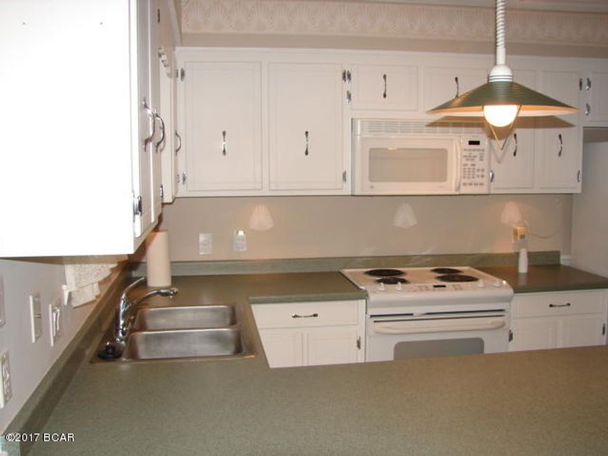 2 Car Carport; Bonus room; W/D Hookup in garage area; privacy fenced yard with deck & patio and storage building; sprinkler on well; centrally located to shopping, dining, and schools