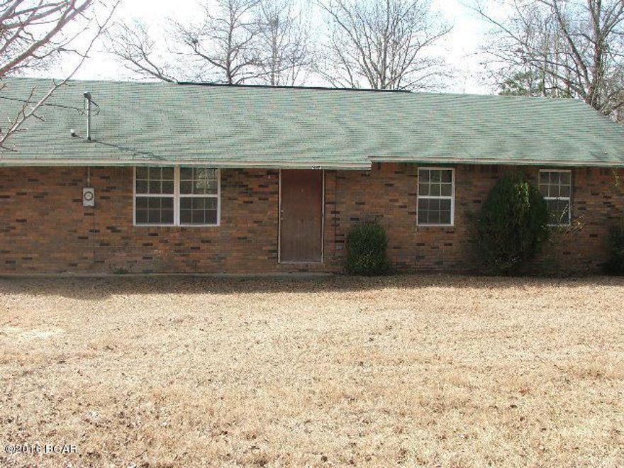 Move in ready brick house in quiet country setting. This home features newer carpet/tile, updated energy-efficient windows throughout, newer refrigerator and smooth cook-top stove. Roof re-shingled approximately 2 years ago. Fencing on three sides with a huge back yard. You must see to appreciate this one!