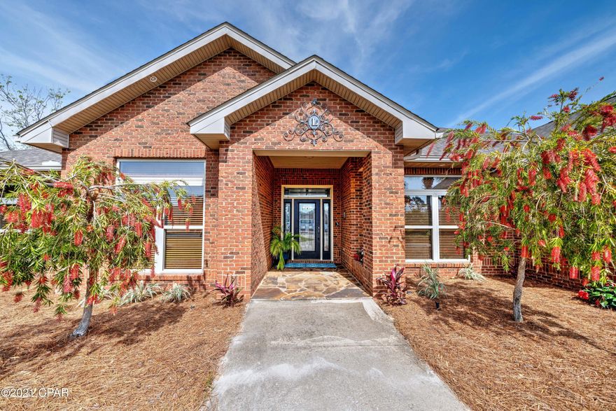 'CURRENTLY UNDER CONTRACT, SELLER ACCEPTING BACKUP OFFERS Dock your boat behind this elegant Canal Front located on an oversized corner lot with a 130 ft dock and has a boat lift. A custom-built home located in the prestigious gated community of Bay Point. 4 bdrm/ 4 bath with all the extras is right at 3,800 sq. ft of living space. It features a gourmet kitchen with a breakfast bar/ breakfast room, Corian-like countertops in the kitchen, etc. The formal living area features a beautiful fireplace as its focal point, along with a separate dining and sitting area. It has a large master suite with a sitting area that overlooks the pool, and the bedroom opens up to the Florida room, leading out to the pool area. The master bath comes with double vanities along with a sitting place to put on you a separate shower and has a walk-in closet for plenty of storage. The whirlpool tub will come in handy to sit and relax and wine down! This home has a split bdrm plan with a bdrm in almost every corner of the house. On the left corner of the home, you have a mother-in-law suite that closes off to your own private area, opens up to the den area, and has another access to the living room. It comes with a full bath as well, and all four bdrms come with a full bath and lots of living spacecustom cabinetry throughout, including the vast laundry off the garage. Enjoy your den area that overlooks the pool with custom wood ceilings and recessed lighting.
A beautiful heated saltwater pool with a hot tub makes a great place to be during those hot summer days. This home has a new roof after Hurricane Michael, along with a new pool screen encloser.  Did I mention your custom built-in office area off the kitchen and has a central vac system installed for your cleaning convenience? This home features a circle drive and a three-car garage, a must-have for this golf cart community. This home comes equipped with three A/C units that are all newer and much needed for this large house. The home has crown molding along with recessed lighting and features beautiful trey ceilings throughout. This beautiful brick home has all you need to call it home.