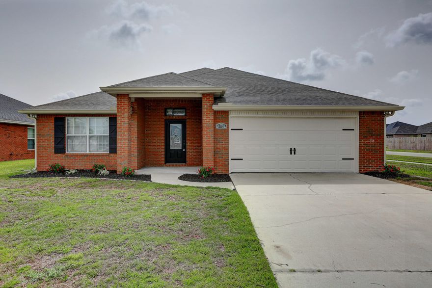 Beautiful brick 3 bedroom, 2 bathroom home in Cedar's Crossing!  House sits on a large corner lot with privacy fence. Everything is freshly painted and garage door is new. The spacious living room has 10 ft ceilings, crown molding, recessed lighting, and an electric corner fireplace.  House has new luxury vinyl plank flooring, carpet in bedrooms and new light fixtures. The spacious kitchen features stainless steel appliances. Master bedroom has tray ceiling and large bathroom with double vanities. 

This home is a must see!