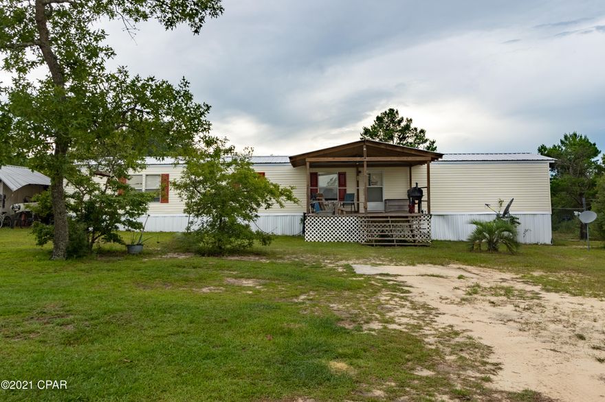 ROOM INSIDE AND OUT, PRIVACY, YOU NAME IT THIS PROERTY HAS IT!!!!  With right at 2300 sq. ft. of living area, 4 bedrooms, 3 full baths, and 5 acres to stretch out on and enjoy country living and privacy because you are at the very end of road!!!! This mobile home has a very large beautifully done addition that added a huge family room. one bedroom, and a full bath! New meatal roof was put on in 2018. You will love the back deck that goes out to the pool area for grilling and chilling!!!! ALL SIZES ARE APPROXIMATE BUYER TO VERIFY////