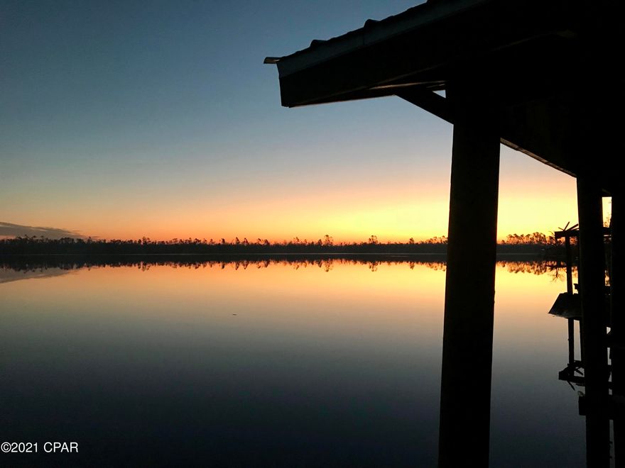 UNDER CONTRACT - TAKING BACK UP OFFERS. This fabulous 3 BR / 2 BA Deer Point Lake - WATERFRONT home w/boat house sits on a large .71 acre parcel and offering over 155'+/- of shoreline!   Featuring 1,876 sq ft, renovated, and comes with a brand new enclosed pole barn for your vehicles, trailers or toys. It has a home office, mud room, and an abundance of storage throughout the property. Solid BLOCK construction w/cypress wrap; the roof is INDUSTRIAL GRADE, 26 gauge, galvanized, max ridge with exposed fasteners and Kynar 500 finish (warranty transferable). The roof is trimmed with seamless gutters as well.  This home has been rebuilt to last and withstand the weather and elements. The back portion of the pole barn offers a large lockable enclosed 24 x 12 storage room. As you enter the home, you can feel the warmth of the the tastefully remodeled kitchen, featuring new SAMSUNG appliances, and highlighted by the handmade island/counter tops.  This countertop wood comes from antique heart of pine from an old grain mill circa 1870.  The copper backsplash in the kitchen comes from American Tin Ceilings and offers a unique rustic look while maintaining its design and purpose. Enjoy convenience of an extra deep farmhouse/apron sink. The kitchen ceiling is lined with ship lap as well as part of the main living area. Stay organized with Schuler custom cabinets and island w/pullout shelves, stacked drawers in utensil drawer, soft close hinges and so much more. From the kitchen, you overlook the living room and through the french doors leading to the panoramic lake views.  This home offers an abundance of upgraded and custom features.  The interior walls and ceilings are hand plastered; designed and crafted by the owner/builder.  You can never be too organized with the built in bookshelves in master bedroom and kitchen.  If that wasn't enough, see the custom walk-in closet with handmade, reclaimed-wood barn doors.  The bedrooms boast solid engineered acacia floors.  Overall, the plumbing is virtually new, to include water heater and Culligan filtration system.  There are also new lighting and ceiling fans.  Much of the electrical was also replaced during the renovation.  Bathroom floors are tiled with Spanish porcelain, while 24" x 12" ceramic tiles are laid throughout the home.

Take the entertainment outside to this lakeside oasis!  Enjoy and spend time with your family while taking in the abundance of natural beauty and tranquility across the lake; relax after a long day's work, fire up the grill, or play with the kids or pets in your huge backyard!  The property is surrounded by a wood privacy fence and split rail front, yet offers unobstructed views of every sunrise/sunset from the 155'+/- of shoreline.   The 360 sq ft bi-level back deck offers an abundance of space to entertain, grill or simply relax.  Store your personal watercraft, or boats in the double slip covered dock!  You will reap the benefit of the newly built pole barn (24'w x 36'l x 14'h) that can easily accommodate an RV or two large trucks.  To the back of the pole barn is a large covered dry storage area (24' x 12') with loft for all your storage needs: yard/tools, equipment, or building materials/supplies; pole barn is enclosed on 3 sides.

In addition, more storage is offered in the large detached storage shed (24' x 24') on the other side of the property.  This property gives you so many options; you could build a garage or even another home on it.  Consider the possibility of building a second home/rental or subdivide and sell separately. HVAC was replaced in 2016.  Irrigation is fed from a lakeside pump; a small portion of the irrigation requires repair. Large public boat ramp is .7 miles away. All measurements are approximate; please verify if important.