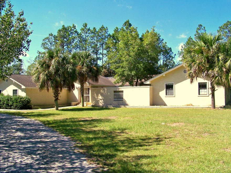 Looking for freedom to spread out?  Need room for a home office?  How about room for mother-in-law?  Looking for a home you can personalize and make your own?  This property is a must see with limitless possibilities. Located just 4.5 miles north of Panama City Mall on 1.17 acres you enjoy privacy, as well as being close to all Panama City has to offer.  Large eat-in kitchen, dining room, family room, den, enormous master bedroom, hefty laundry room with space for storage. Two additional bedrooms and another huge room with 1/2 bath that could be used as an office, game room or exercise room. The kitchen features tiled counter tops and wood flooring with substantial cabinet and counter space. A second laundry room just off the kitchen could easily be converted into a large walk-in pantry. A breezeway leads to a double car garage with two storage rooms. You also have a covered deck/patio and double carport. Another covered deck overlooks the back yard and small fish pond. This home offers ample room for both indoor and outdoor gatherings and living. This is a Fannie Mae Property.  All measurements, ages, and room sizes are approximate. Please verify if important.