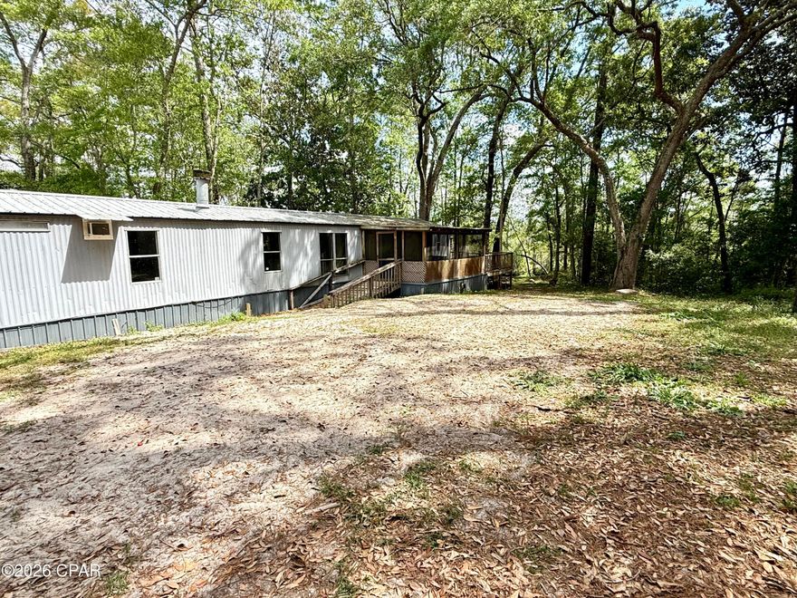 Waterfront opportunity on Black Creek!
 This 3-bedroom, 2-bathroom mobile home sits on over half an acre, offering the perfect setup for an investment property, weekend retreat, or full-time living on the water. Enjoy peaceful creek views with direct access to great fishing right from your backyard.

Located just minutes from the Choctawhatchee Bay, this property is ideal for boating, fishing, and enjoying the outdoor lifestyle. You're also less than 30 miles from Crab Island and the white sand beaches of Destin, FL--giving you quick access to shopping, dining, and entertainment.

The property features a separate electric hookup, providing an excellent opportunity for an additional camper or mobile home, adding even more income potential or space for guests.

Whether you're looking to invest or create your own waterfront getaway, this property offers endless possibilities. Schedule your showing today!

Buyer/Buyer's agent to satisfy themselves to all pertinent information regarding the property.