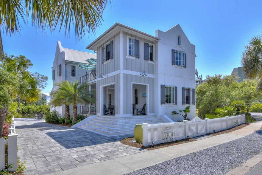 155 Parkshore Drive - 4 Bedroom 3.5 Bath Luxury Coastal Home in popular Carillon Beach. The owners paid attention to the most minute details in making their home, Kumbayah, comfortable yet luxurious, spacious yet cozy and safe yet stunning. It is the ultimate coastal beach home finished with a mixture of coastal, industrial and modern architectural elements. These elements  include coffered ceilings lined with barnwood, shiplap, and board and batten accent walls, exposed beams, flooring of porcelain, wood and travertine tile. Marvin casement windows decorated with custom designed shades and shutters, and transomed doors, usher cool salt breezes throughout the house. Entertainment is a focus with a well appointed side porch, sun porch and large back porch with gas grill, and Vision Komado Ceramic Smoker. The sunken living room boasts a glass rock and driftwood fireplace and makes for the perfect entertainment extension to the back porch. The kitchen is open and airy with quartz countertops and upscale appliances throughout. (Wolf and GE). - wine refrigerator, ice maker, dishwasher, professional refrigerator/freezer, and Navien water heater. Multiple windows ,warm wood floors in addition to a well planned master bath with slipper soaking tub centerpiece, walk in shower, double sinks and a view, make the master suite a peaceful retreat.