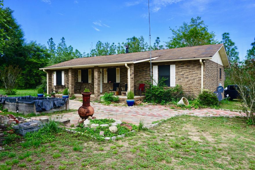 $7,000 Allowance for your NEW METAL ROOF!!! This 3 bedroom 2 bath Brick Home with a barn and Bi-level storage Building is waiting for you. Parcel is fenced and has a privacy gate. Home is just minutes away from Econfina Springs, kayaking, swimming, Camping and some of the best fishing on the planet. Famous Pier Park shopping and The Worlds Most Beautiful Beaches are just a short drive away. Home has an open concept and is ready for your finishing touches. Porches on front and back allow you to relax and watch the deer come out at dusk. Nestled in between the Cities of Chipley and Panama City, you are only minutes away from fine dining, movies, shopping, and whatever else you want to do. Call for your private showing today. Check out our virtual tour in the upper right corner.