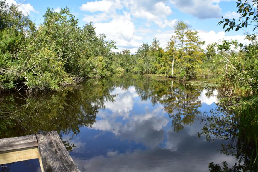 Waterfront on Bayou George! Enjoy being in the country on the water within minutes to town! All info is approx and must be verified by the BUYERS if important.