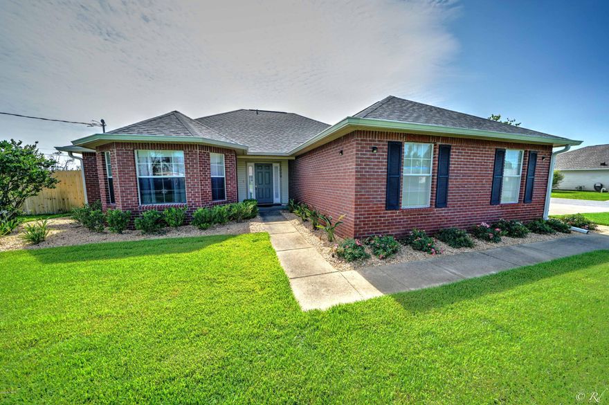 Immaculate home that sits on large corner lot in the heart of Lynn Haven. Split bedroom floor plan. Home is spacious and features cathedral ceiling ,wood burning fireplace, Armstrong pryzm rigid core hybrid flooring and dining area. Remodeled eat in kitchen with Silestone counters and pantry. Trey ceiling and walk in closet in master bedroom. New roof, new privacy fence, sprinkler system with new well, 2 car side entry garage