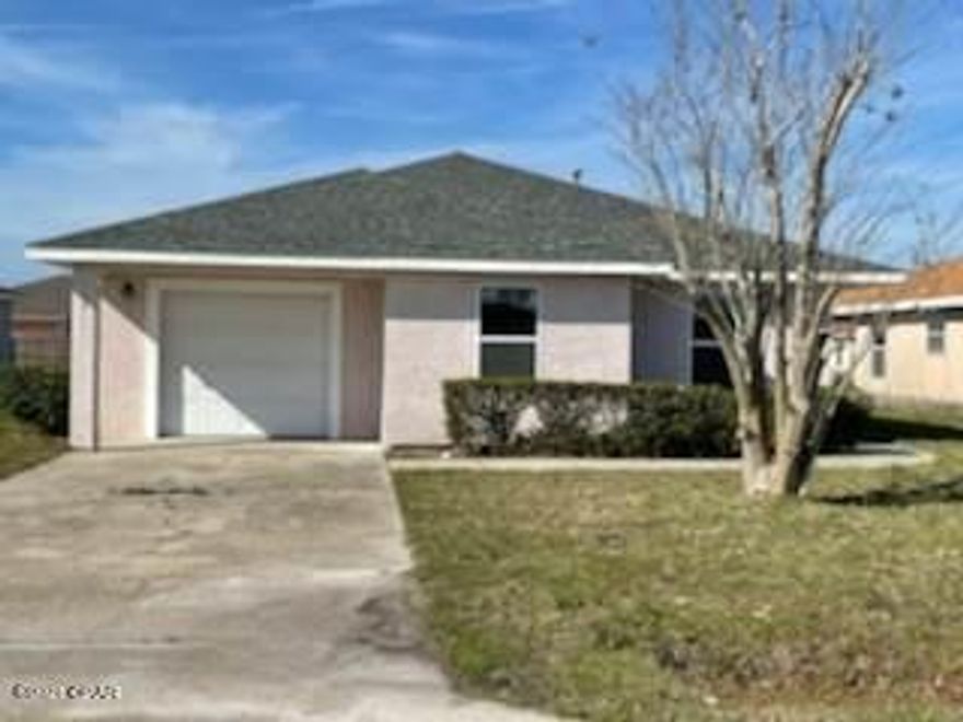 3 Bedroom 2 bath stucco home conveniently located between Tyndall and the Mall..  Home has vinyl plank flooring, new roof, new windows. The kitchen is large and has a breakfast bar. There is a 1 car garage.