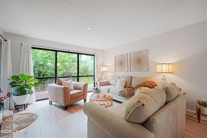 WOW HOA reduced their fees! They include cable, water, trash, landscape, and pool. $1586/quarter. Welcome to your peaceful retreat in The Glades -- a beautifully updated ground-floor condo offering privacy, sophistication, and a coveted beachside lifestyle.

This charming and spacious 2-bedroom, 2-bath residence is perfectly designed for both comfort and convenience. With a thoughtful split-bedroom layout, each oversized bedroom is located on opposite ends of the home, offering optimal privacy and tranquility -- ideal for hosting guests or enjoying quiet moments to yourself.

Step inside to find light and airy interiors filled with natural sunshine, thanks to large sliding doors. The open living area flows effortlessly into the kitchen, where  stainless appliances, and a shiplap-accented bar set the tone for coastal elegance. Both bathrooms have been upgraded with quartz tile showers, adding a touch of spa-like luxury.

Enjoy private preserve views from the living room and main en suite, and unwind on your secluded patio that opens directly to a serene natural backdrop -- the perfect spot for morning coffee or a quiet evening glass of wine. The covered entry adds a welcoming touch, and with the convenience of ground-floor access, this condo lives like a private villa.

You're just a 7-minute golf cart ride from the world-famous white sand beaches of the Gulf, and only minutes from Pier Park, Duplin Winery, golf, and all the best dining, shopping, and entertainment Panama City Beach has to offer.

The Glades community offers well-maintained amenities including a sparkling pool, and the neighborhood's quiet, tucked-away vibe makes it feel like a true hidden gem -- all while keeping you close to the action.

Whether you're looking for a full-time residence, vacation getaway, or investment opportunity, this condo delivers luxury, location, and lifestyle in one unbeatable package.

Schedule your private showing today -- your coastal escape awaits.