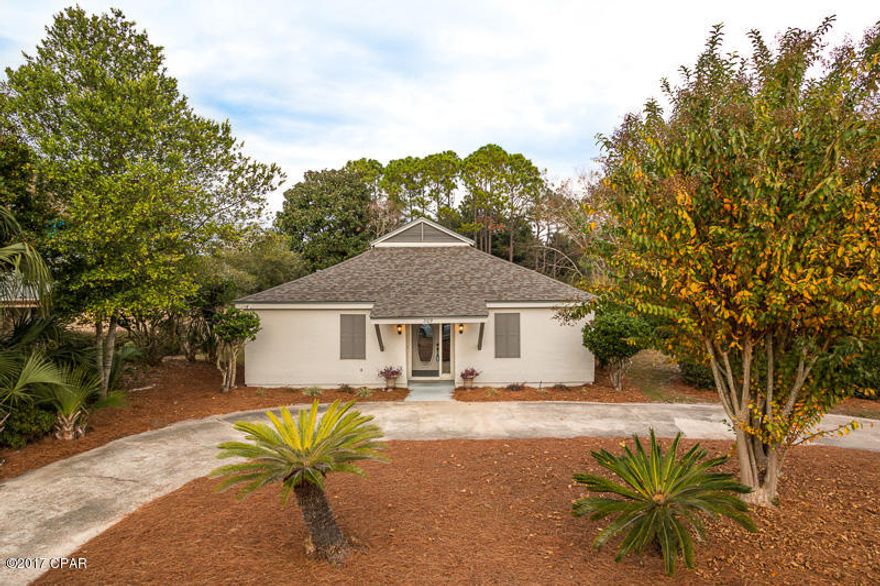 Paradise at the Point! This Gorgeous 2 bedroom/ 2 bathroom Florida style cottage is a dream home in the much desirable golf community of Bay Point. The curb appeal alone is hard not to fall in love with. When you walk in the front door you automatically feel at home. The living room invites comfort and exudes modern excellence with its exquisite modern style fireplace and beautiful stained wood. Other features of the home include dark wood floors, wonderful fixtures and new dark wood cabinets. The home has had many updates including having a roof installed less then a year ago, AC installed 3 years ago and a new hot water heater installed 3 years ago. The kitchen features a large breakfast bar which opens up to your dining and living room. With newly updated countertops, brand new appliances, and a huge pantry you can enjoy cooking all of your favorite meals. At the front of the home you have one bedroom with its own full size bathroom and in the master bedroom you have your private full sized bath along with private access to the screened in porch with an angelic view. Take a walk through the private marina or enjoy a day at the pool while watching the gorgeous sunsets over the lagoon. Other activities include a famous golf course and a large dog park. Redfish circle is a very quiet road conveniently located close to the main entrance and the back gate of Bay Point while being away from the main traffic areas. You can't beat this location, Close to the beach, schools, shopping and the best restaurants in Bay County. Don't miss your opportunity for such an amazing home, schedule a showing today!