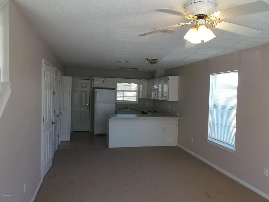 Nice town home in Treasure Cove with open floor plan, balcony, privacy fenced back yard, storage room, breakfast bar and separate bathrooms per bedrooms. Utility closet with washer & dryer connections, 1/2 bath downstairs and rear patio.