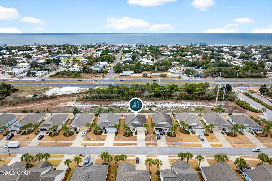 Experience low-maintenance coastal living in this 3BR/2BA home in Whisper Dunes, located just a half-mile from dedicated beach access. Whisper Dunes remains one of the West End's most desirable primary-residence communities, known for its pet-friendly atmosphere, consistent upkeep, and HOA-covered lawn care that simplifies everyday living.

Designed with both durability and comfort in mind, this home features 2x6 construction, Hardie board siding, 6-inch exterior walls, and a 30-year architectural shingle rated for 130 mph winds -- details that matter in today's insurance and long-term ownership landscape. A 5-star energy rating, high-efficiency Low E2 windows, and a 14-SEER heat pump further enhance efficiency and livability.

Inside, the open floor plan offers large designer tile throughout, 8-foot doors with craftsman-style trim, and abundant natural light from oversized windows. The kitchen is thoughtfully appointed with stainless appliances, granite countertops, under-cabinet lighting, and generous storage -- creating a functional gathering space that connects seamlessly to the main living area.

The primary suite features tray ceilings and an ensuite bath with double vanities and matching granite surfaces. Two additional bedrooms and a full bath provide flexibility for guests, home office needs, or family living.

French doors open to a covered porch with a remote-controlled electric screen, extending your living space outdoors. The fenced backyard offers privacy for pets or entertaining, while the garage includes a newly epoxy-coated floor completed in 2025 for a clean, durable finish.

Residents of Whisper Dunes enjoy a community pool, cabana, landscaped walking paths, and sidewalks throughout the neighborhood -- all just minutes from Pier Park, 30A, Camp Helen State Park, Lake Powell, and the conveniences of Publix, ALDI, and local dining.

For buyers seeking a well-built, low-maintenance home near the beach within a primarily full-time residential setting, this Whisper Dunes property represents a strong opportunity on Panama City Beach's West End.