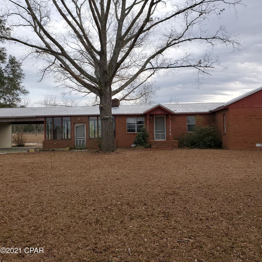 FIXER UPPER INVESTMENT OR GOOD STARTER HOME!  This home needs some updating and repairs but will be a great home for someone.  The 1.3 acre lot is convenient to the town of Malone.  This would be a great potential Income Property in that area.  The original portion of the home has hardwood floors.  EXTRA LARGE Kitchen that could also be the Family Area and Dining.  Separate room could be living room.  Guest Bathroom is partially updated.  Master Bathroom has been completely renovated. This home has a glassed in Sunroom next to the Covered Carport and utility room.  Large covered deck on the back of the home is a great place for relaxing!  This is a Great Handy Man Project!