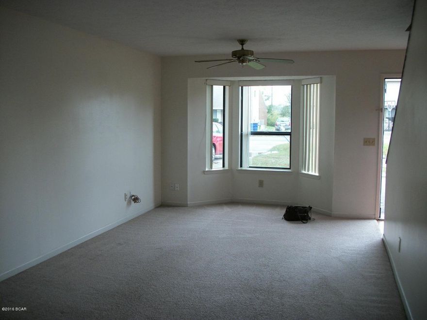 Centrally located town home within walking distance to Northside Elementary School; shopping amenities on 23rd and 15th Streets are nearby.  Washer/dryer hookups in utility closet off kitchen; locked storage room off patio.  Room sizes and sq.ftge. are approximate.  NO PETS-non-negotiable. $30 application fee.  One year lease is required.  Listing agent is owner.
