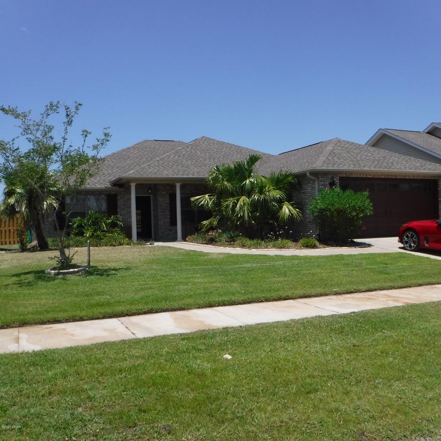 Beautiful centrally located executive home in upscale neighborhood convenient to Lynn Haven, NAS and Tyndall AFB.  This home has a open floor plan with hardwood floors in LR and carpets in Bedrooms.  Just off the LR is a office with french doors. Shiplap accents the LR walls and fireplace. Granite counter tops through out. Lots of cabinets and granite counter tops in the kitchen with walk-in pantry.  Master Bedroom is huge with walk in closet, double granite top sinks, oval soaking tub, separate walk-in shower. The master bedroom open's up to the screened in back patio overlooking the spacious, Privacy fenced back yard.