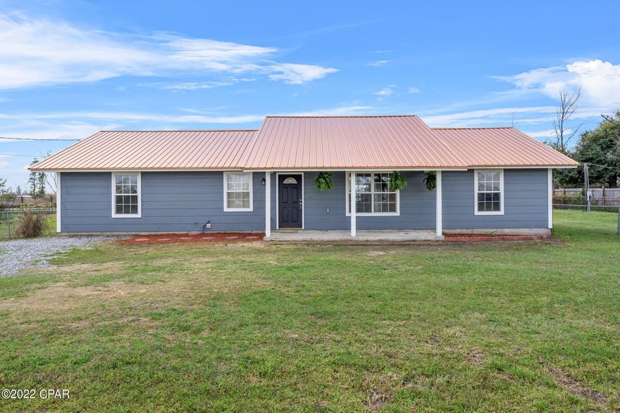 CURRENTLY UNDER CONTRACT, SELLER ACCEPTING BACKUP OFFERS. Beautiful well built home just under 1/2 an acre with newer roof (2019) and low maintenance HardiBoard siding.  Flooring in the main living areas is Vermont cherry-knot pine.  Newer water heater in 2020.  Master bath features slate tiled flooring and has wiring connection for a future jacuzzi tub.  10' ceilings in living room with recessed lighting.  Plenty of storage in the yard buildings for your equipment and She-Shed re-do! This home is convenient to Tyndall Air Force Base, schools, and shopping.  Also, nearest emergency room is only a little over 1/2 a mile away.   Property is bonded with FL Pest Control.   If square footage deemed important, please measure.