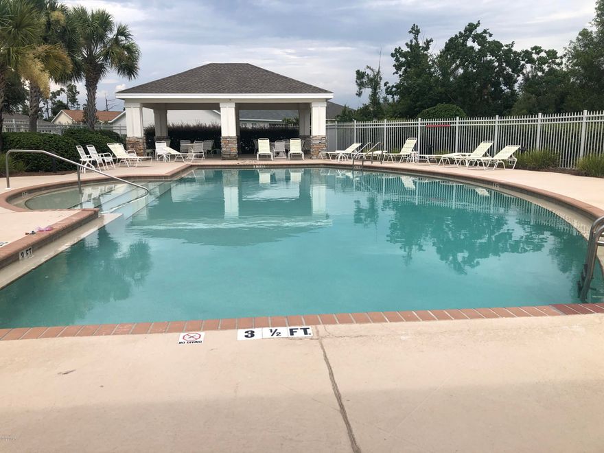 Three bedroom two bath Both guest bedrooms are spacious with walk-in closets and share a hall bathroom complete with full-sized tub and shower combo. A cozy breakfast nook connects the living room to the office and provides a comfortable space to watch TV and enjoy meals together. The fenced backyard has shade trees and can be enjoyed in your screened-in patio off the back of the home. New roof in August of 2019.  Professionally painted kitchen cabinets. This home is minutes from shopping, hospitals, both military bases, desirable Bay Haven Charter Academy, and great public schools. The Hammocks subdivision is a planned community living with landscaped entryways, dog walking areas, community pool and clubhouse. EASY TO LOVE! EASY TO SHOW!