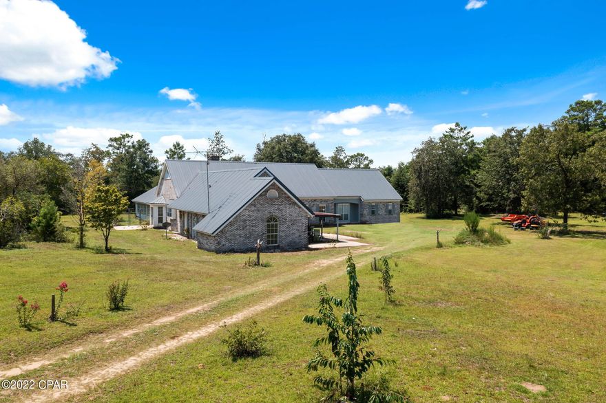 This expansive, 4,333 square foot custom-built 2-story brick home with an indoor, in-ground pool is situated on over 10 acres in the country. The 1st floor features a large kitchen, walk-in pantry, dining room, breakfast area, laundry room, den, living room, 2 half baths, and the second bedroom. The master bedroom, on the 1st floor, is joined by a large en-suite featuring a jacuzzi tub, steam shower, double vanities, and 2 walk-in closets. Ascend the oak staircase into a sitting area and 2 bedrooms, joined by a jack-n-jill full bathroom. The home needs some work, but seller has all of the materials. The 16x36 in-ground pool has a new liner and is located inside with a bathroom. Metal roof '16, on demand water heater '17, a/c units '15. Cash or conventional only, selling as-is. The attached one-car garage/workshop leads out onto a concrete slab. There is also a covered patio on the front of the home by the den. On the back of the home is another patio that is uncovered. The water heater is ran by a propane tank that is owned and conveys with the sale. There is also a fenced in area beside the pool room for your animals. The circular driveway leads around the property from Pine Log Rd. to Tea Pond. There is water available throughout the grounds of the property. Current zoning is agriculture/silviculture so bring your animals and grow a garden! The property is high and dry and is not located in a flood zone.