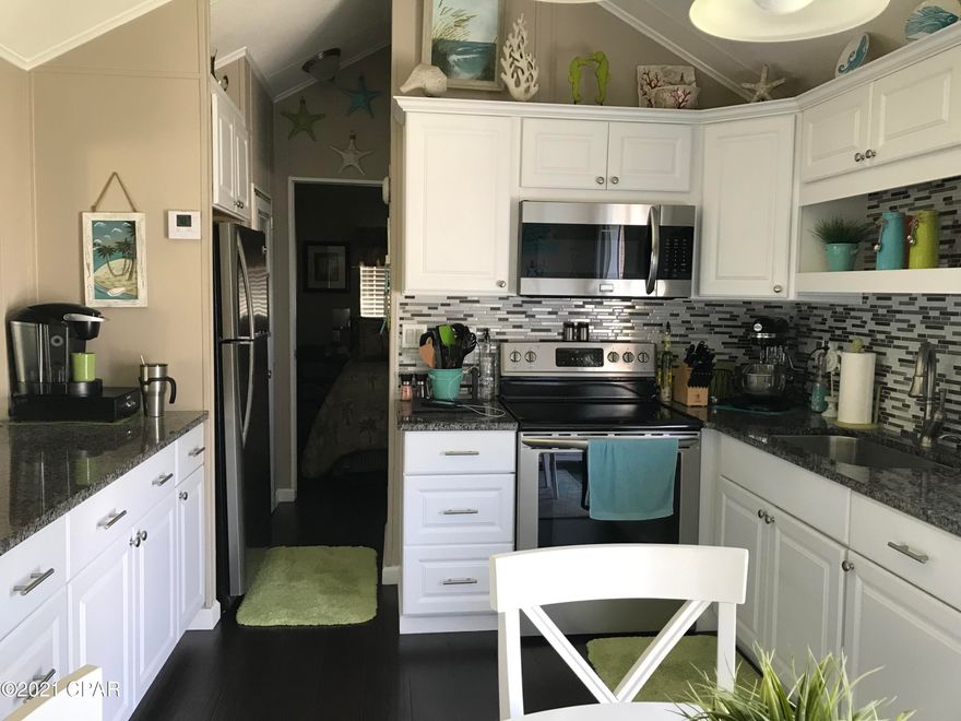 For Comp Purposes Only - Sold Fully Furnished with golf cart. Two Bedroom, two bath home with Add on Living room, walk in laundry room, covered carport and separate storage building. Kitchen is updated with granite, updated cabinets and stainless appliances.
