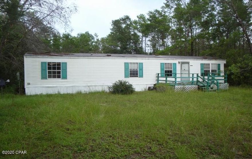 INVESTORS ALERT!! Mobile Home - 2 Bedroom 1 Bath located on over 1 acre cleared level lot. Well, Septic tank in place, Needs TLC but would make a good rental property or you could build your dream home here. There are some beautiful homes in the neighborhood. Son is selling Father's home we have clear title. A clean-up, some minor repairs and paint and this is ready to roll. Property sold AS IS, no repairs will be made by Seller. Price reflects this. Cash sale preferred. Vacant on lockbox contact Selling Agent for Code.  NO HOA but there are some restrictions on DEED see Documents for information. All measurements are approximate buyer to verify if important.