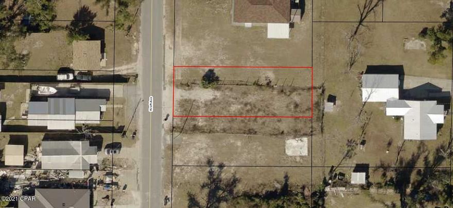 Chain link fenced and mostly cleared